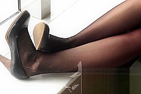 #64 black stockings on window seat