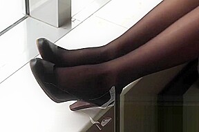 #64 black stockings on window seat