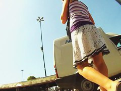 A couple of ladies are in an upskirt porno where their asses are shown