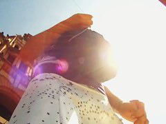 A couple of ladies are in an upskirt porno where their asses are shown
