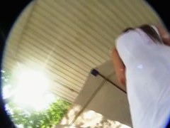 A sexy brunette with a really nice ass standing outside in an upskirt vid