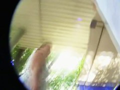 A sexy brunette with a really nice ass standing outside in an upskirt vid