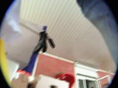 A sexy brunette with a really nice ass standing outside in an upskirt vid