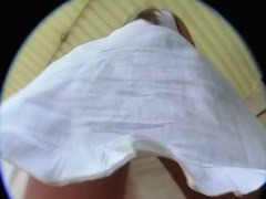 A sexy brunette with a really nice ass standing outside in an upskirt vid
