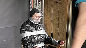 Alice Taped To A Chair And Tapegagged In Shiny Nylon Downjacket