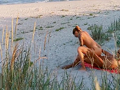 Amateur couple got caught having sex on the beach by  