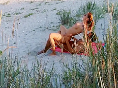 Amateur couple got caught having sex on the beach by  