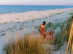 Amateur couple got caught having sex on the beach by  