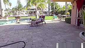Amazing redhead tanning by the pool