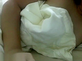 Asian girl plays with boobs
