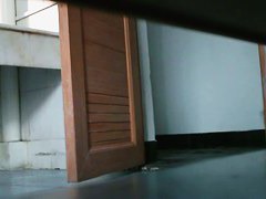 Asian nerdy chick takes a leak and gets on hidden pee cam video