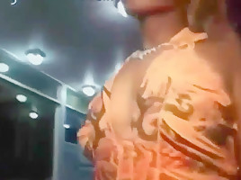 Ass in short orange dress