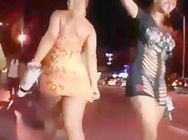 Ass in short orange dress