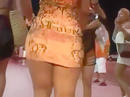 Ass in short orange dress