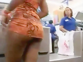 Ass in short orange dress