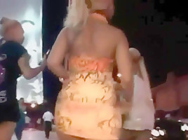 Ass in short orange dress