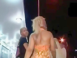 Ass in short orange dress