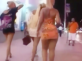 Ass in short orange dress