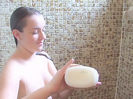 Beautiful curvy brunette takes a sexy shower