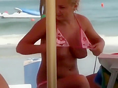 Blonde lady about to cover her boobs