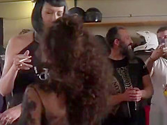 Bound brunette humiliated in bikers shop