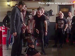 Bound brunette humiliated in bikers shop
