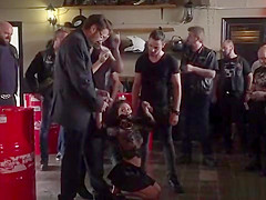 Bound brunette humiliated in bikers shop
