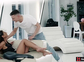 Brunette girlfriend riding bf while her foot in his mouth
