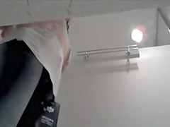 Brunette in fitting room is showing her booty cheeks