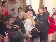 Brunette slave gets facials in public