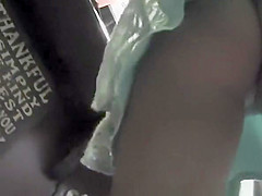 Busty milf in short green skirt upskirted