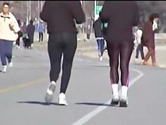 Candid babes in spandex pants are running in the street 01zc