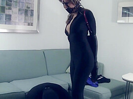 Candle In Sexy Catsuit Bound And Gagged