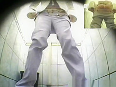Cute blonde pissing in public toilet