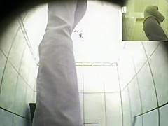 Cute blonde pissing in public toilet
