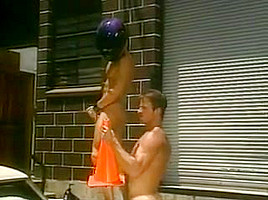 Cute guy takes massive toy traffic cone fist