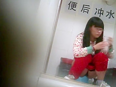 Geeky chinese girl spied while pissing