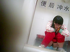 Geeky chinese girl spied while pissing