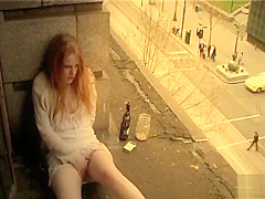 Ginger girl masturbates in public outside her apartment
