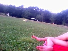 Girl in tiniest bikini getting sun tanned in the field PICT0011