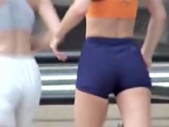 Girls in candid sports shorts roller skating in the street 07zt