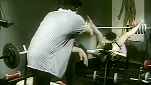 Horny lady fucks two dudes in a gym
