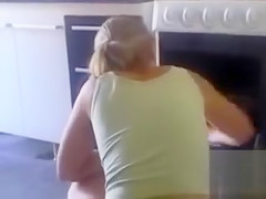 Ideal housewife is cleaning the kitchen in panties