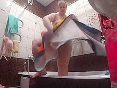 Lesbian has installed a in the bathroom at his girlfriend  Peeping behind a bbw with a big ass in the shower 