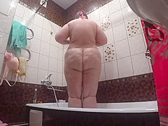 Lesbian has installed a in the bathroom at his girlfriend  Peeping behind a bbw with a big ass in the shower 