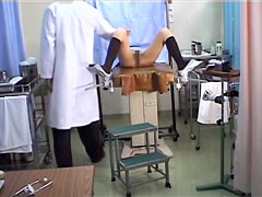 Lovely Japanese gets her pussy toyed during a Gyno exam