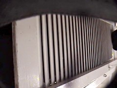 Man with cam trying to see something in change room