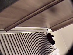 Man with cam trying to see something in change room