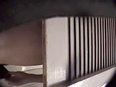 Man with cam trying to see something in change room
