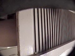 Man with cam trying to see something in change room